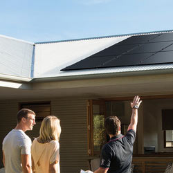 Couple getting a free in-home solar assessment form a Solahart dealer.